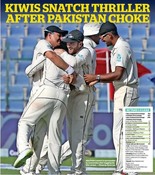  ?? Photo by Ryan Lim ?? Ajaz Patel (centre) is surrounded by teammates after bagging his fifth wicket. —