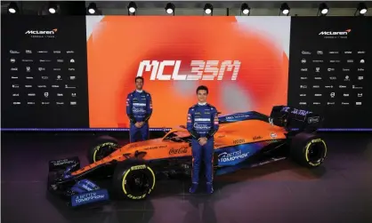  ??  ?? Daniel Ricciardo (left) and Lando Norris stand alongside the new McLaren MCL35M. Photograph: McLaren