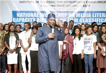  ??  ?? Executive Director, ISDEVCOM, Prof Emmanuel Dandaura flanked by students in one of the sessions