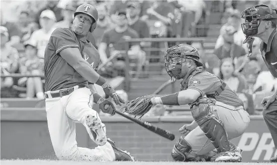  ?? Karen Warren photos / Houston Chronicle ?? Rangers third baseman Adrian Beltre, a member of the 3,000-hit club, was brought to his knees by this Gerrit Cole pitch in Sunday’s third inning at Globe Life Park.