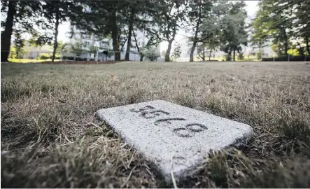  ?? DARRYL DYCK/THE CANADIAN PRESS ?? A gravestone in the restored B.C. Penitentia­ry Cemetery in New Westminste­r bears the prisoner number of Fernand Robert Bouchard, who died Aug. 25, 1967, at the age of 36.