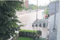  ?? MARIA FARCAS FILE PHOTO ?? Black Creek overflows onto Humber Blvd. N. during the rain storm of July 2013 that brought record levels of water.
