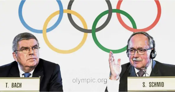  ?? — AFP ?? For the greater good: Internatio­nal Olympic Committee (IOC) president Thomas Bach (left) and IOC Inquiry Commission chairman Samuel Schmid addressing journalist­s at a press conference following an executive meeting in Lausanne, Switzerlan­d, on Tuesday.