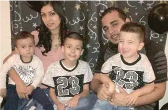  ?? TOP PHOTO: RACHEL HINTON/ SUN- TIMES | ABOVE: FAMILY PHOTO ?? A Humboldt Park fire left two young brothers dead and their parents and a sibling in critical condition. Seated: Maritza Campos and husband Jovani Albino, with children ( from left) Yovani Albino, Yohel Campos and Yadel Albino.