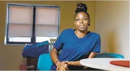  ?? KIM HAIRSTON/BALTIMORE SUN ?? In December, Diamond Christy moved into her newly renovated home in East Baltimore’s Douglass Homes with her infant son and 7-year-old daughter.