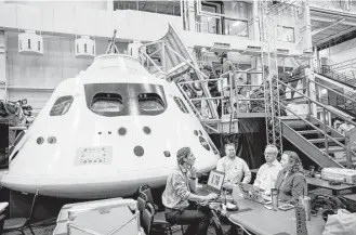  ?? Brett Coomer / Houston Chronicle ?? An Orion capsule mock-up is being studied by NASA experts, determined to test an unmanned spacecraft in late 2019 or mid-2020, depending upon rocket constructi­on timelines.