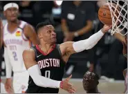  ?? ASSOCIATED PRESS FILE PHOTO ?? Houston Rockets’ Russell Westbrook (0) goes up for a shot as Oklahoma City Thunder’s Nerlens Noel, right, defends during the second half of a Sept. 2 first-round playoff game in Lake Buena Vista, Fla.