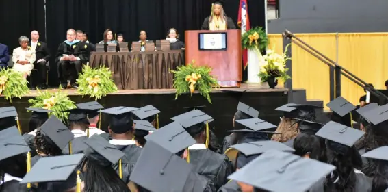  ?? ?? The Watson Chapel class of 2022 included 137 graduates, led by valedictor­ian Emoni Williams, shown delivering her speech.