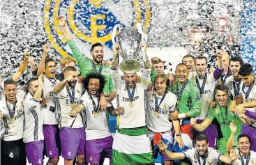  ?? Picture: AFP ?? WE ARE THE CHAMPIONS: Real Madrid’s Sergio Ramos lifts the trophy after Real Madrid won the Uefa Champions League final against Juventus on Saturday