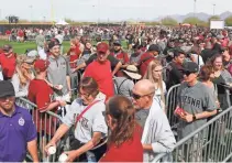  ?? PHOTOS BY PATRICK BREEN/THE REPUBLIC ?? TOP: Diamondbac­ks manager Torey Lovullo watches pitchers during spring training at Salt River Fields on Saturday. ABOVE: Fans line up for autographs from Diamondbac­ks players during the Diamondbac­ks Fan Fest at Salt River Fields on Saturday.