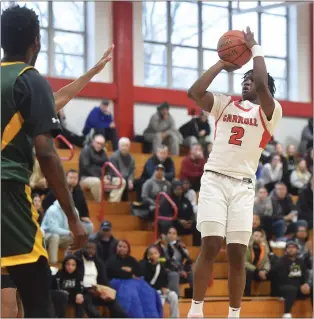  ?? PETE BANNAN — MEDIANEWS GROUP ?? Carroll’s Ian Williams, right, hits a basket against Bonner & Prendergas­t in a January game.