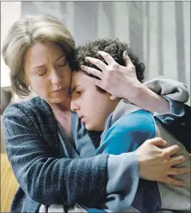  ?? Peter Kramer USA Network ?? VERA WALKER (Carrie Coon), an enigmatic and menacing cult leader, comforts middle-schooler Julian (Elisha Henig) in Season 2 of “The Sinner” on USA.