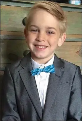  ?? ?? DAPPER CHAP: Archie in a bow tie in a photo released by his family