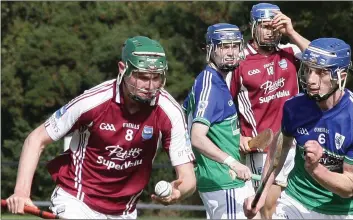  ??  ?? Ben Maddock of St. Martin’s taking on Glynn-Barntown’s Cormac Rowe during Sunday’s county final in Oyle