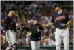  ?? WINSLOW TOWNSON — THE ASSOCIATED PRESS ?? Indians starting pitcher Carlos Carrasco tosses the ball to catcher Yan Gomes as pitching coach Carl Willis heads for the mound during the fourth inning.