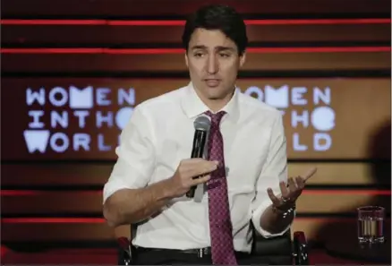  ?? RICHARD DREW, THE ASSOCIATED PRESS ?? Canada’s Prime Minister Justin Trudeau speaks during the Women in the World Summit at Lincoln Center in New York, Thursday. The theme of his visit was to promote the idea of getting more women into corporate boardrooms.