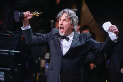  ??  ?? Rhode Island native Peter Farrelly accepts the Oscar for original screenplay for “Green Book” on Sunday during the 91st Academy Awards, at the Dolby Theatre in Hollywood. “Green Book,” which he also directed and produced, won Best Picture.