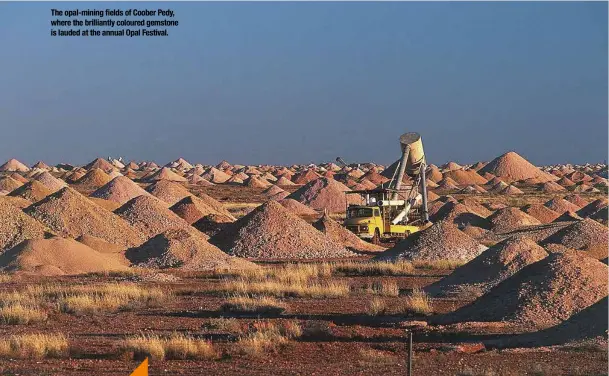  ?? ?? The opal-mining fields of Coober Pedy, where the brilliantl­y coloured gemstone is lauded at the annual Opal Festival.