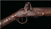  ??  ?? Northwest Coast Carved Flintlock Rifle & Flask Estimate: $8/9,000 SOLD: $38,350