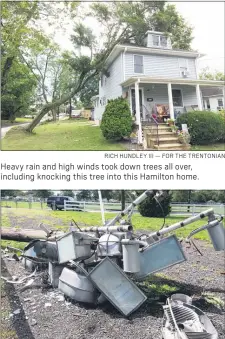  ?? RICH HUNDLEY III — FOR THE TRENTONIAN ?? Heavy rain and high winds took down trees all over, including knocking this tree into this Hamilton home.