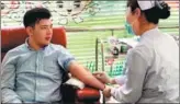  ?? PROVIDED TO CHINA DAILY ?? Tulenov Ruslan of Kazakhstan gets ready to give blood at a donation center in Beijing in February. He’s so far donated over 5,000 milliliter­s, more than is in a human body.