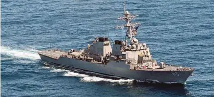  ?? AFP PIC ?? United States Navy destroyer USS ‘John S. McCain’ sailed close to an artificial island China has built up in the South China Sea as part of a ‘freedom of navigation operation’ on Thursday.