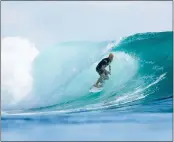  ?? ED SLOANE — WORLD SURF LEAGUE ?? Santa Cruz’s Nat Young surfs in Heat 4of the Opening Round at the Quiksilver Pro G-Land in Banyuwangi, Indonesia, on Saturday.