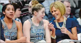  ??  ?? UConn associate head coach Chris Dailey, right, jokes with Katie Lou Samuelson, center, as Gabby Williams watches play during a game against South Florida last season. The Connecticu­t Sun announced Monday that Dailey has been selected to receive the...