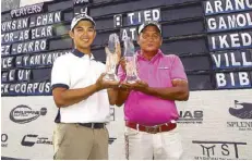  ??  ?? Rey Pagunsan (right) and Aidric Chan hold their trophies after routing the Delimondo Pro-Am field by six.