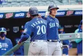  ?? STACY BENGS/ASSOCIATED PRESS ?? Seattle’s Taylor Trammell is congratula­ted by teammate Kyle Seager after Trammell scored the winning run in a victory over Minnesota.