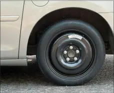  ?? DREAMSTIME — TNS ?? Your van comes with a space saver spare tire.