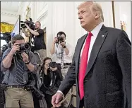  ?? AP/ANDREW HARNIK ?? President Donald Trump enters the East Room of the White House on Wednesday for a Medal of Honor ceremony. In an interview, he said payments his former attorney Michael Cohen made to two women “came from me” not from campaign funds.