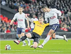  ?? REUTERS ?? Tottenham’s Erik Lamela, right, scores their second goal against Newport.