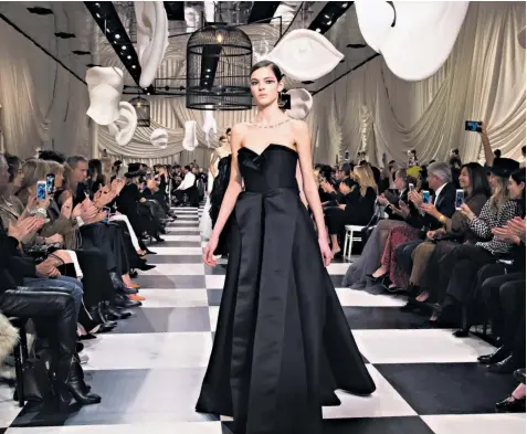  ??  ?? The Christian Dior show in Paris yesterday was mainly a black and white production, with 90 per cent of the collection modelled on the catwalk consisting of evening wear