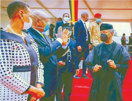  ??  ?? Vice President Yemi Osinbajo ( right); Uganda President Yoweri Museveni and his wife, Janet, during the sixth inaugurati­on of Museveni at the Kololo Independen­ce Grounds in Kampala Uganda… yesterday.