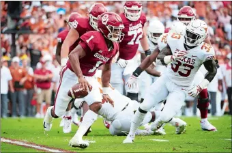  ?? AP FILE PHOTO ?? Oklahoma quarterbac­k Kyler Murray (1) scrambles during a regular-season game against Texas at the Cotton Bowl in Dallas. The two rivals play for the Big 12 title on Saturday and the Sooners are in a position to earn a spot in the College Football Playoff national semifinals with a win.