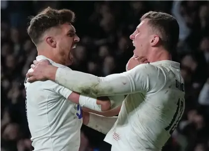  ?? ?? England's Fraser Dingwall, right, celebrates with Henry Slade after scoring his side's second try during the Six Nations rugby union match between England and Wales at Twickenham stadium in London, Saturday,Feb. 10, 2024. (AP Photo/Alastair Grant)