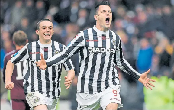  ??  ?? EARNING OUR STRIPES: Celebratio­ns start after St Mirren won the Scottish Communitie­s League Cup final at Hampden in 2013.
