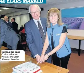  ??  ?? Cutting the cake Chairman Robert Williams and Sarah Sillars cut the cake