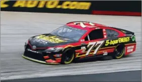  ?? WADE PAYNE — THE ASSOCIATED PRESS ?? Erik Jones drives through a turn during qualifying at Bristol Motor Speedway on Friday.