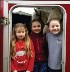  ??  ?? Anxiously waiting for the hunt to start at Duagh village on Sunday were Emily and Amy O Keeffe with Lucy Kelly.Pic Moss Joe Browne.