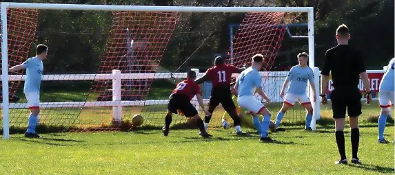  ?? Picture: Peter Langley ?? Rockleaze Rangers (red) score a goal in their 3-2 Gloucester­shire County League defeat at Quedgeley Wanderers