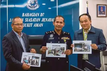  ?? PIC BY MUHD ZAABA ZAKERIA ?? Bukit Aman Anti-Vice, Gambling and Secret Societies (D7) principal assistant director Datuk Rohaimi Md Isa (centre) showing images of raids under Op Limau at the Bukit Aman police headquarte­rs in Kuala Lumpur yesterday.