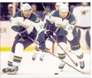  ?? RALPH BARRERA/ AMERICAN-STATESMAN ?? The Stars’ Gemel Smith (left) and Cameron Gaunce lead a power play against the Barons on Oct. 29. Texas scored three power-play goals.