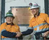  ?? RIO TINTO ?? Mongolian Prime Minister Luvsannams­rain Oyun-Erdene, left, shakes hands with Rio Tinto Chief Executive Jakob Stausholm on Monday at the Oyu Tolgoi mine.