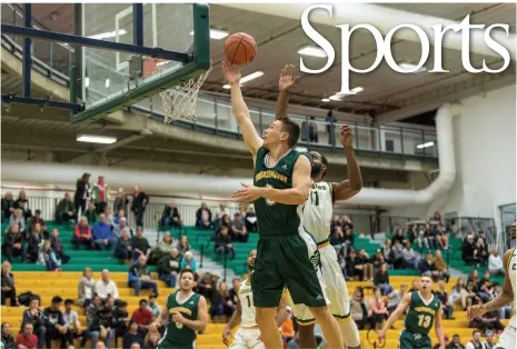  ?? CITIZEN FILE PHOTO ?? Marcus MacKay of the UNBC Timberwolv­es finishes a drive to the basket during a game against the University of Regina Cougars on Nov. 18 at the Northern Sport Centre. The T-wolves will resume their Canada West schedule on Friday night when they take on...