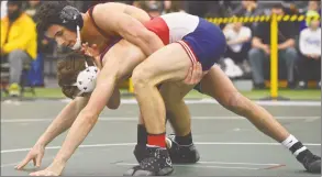  ?? H John Voorhees III / Hearst Connecticu­t Media ?? New Canaan’s Tyler Sung and Berlin’s Daniel Veleas wrestle in the finals for the 145-pound weight class in the Connecticu­t State Open championsh­ips on Saturday at the Floyd Little Athletic Center, New Haven.