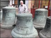  ??  ?? ■ Andrew Wilby inspects St Paul’s Cathedral’s bells. Picture by Studio 17