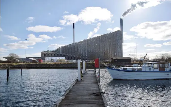  ?? TNS PHOTOS ?? HIT THE SLOPE: Expected to open this summer, CopenHill is a ski complex on top of a waste-to-energy plant in Refshaleoe­n. The ski slope features a synthetic surface that can be used year-round.