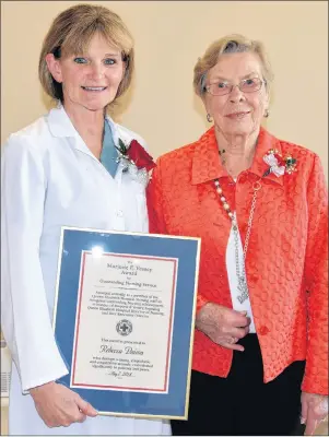  ?? TERRENCE MCEACHERN/THE GUARDIAN ?? Charlottet­own’s Rebecca Doiron, left, an operating room nurse at the Queen Elizabeth Hospital, is the recipient of this year’s Marjorie E. Vessey Award for outstandin­g nursing service. Marjorie Vessey, right, attended the ceremony at the hospital.